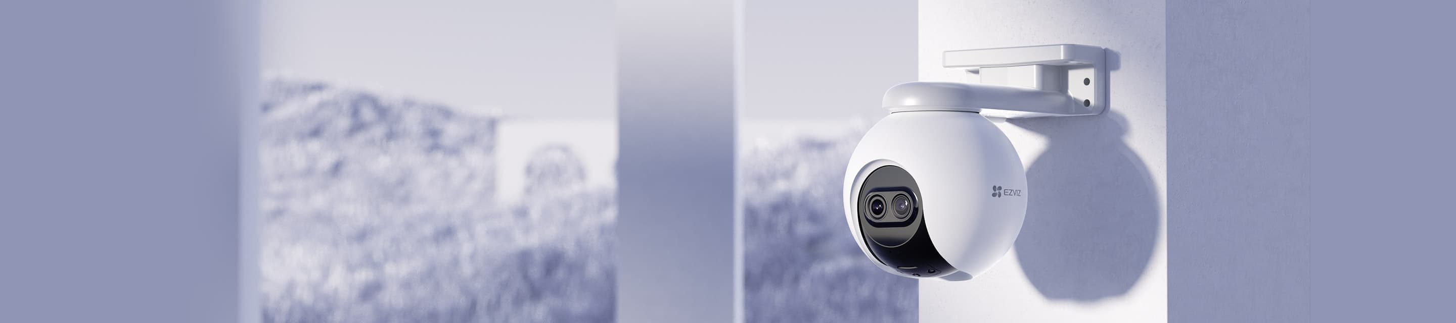 EZVIZ outdoor pan-and-tilt camera mounted on a villa wall